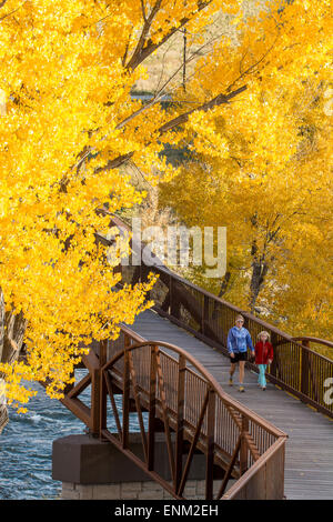 A mother and daughter walking on the Animas River Trail in Durango, Colorado.