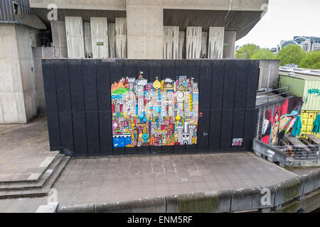 Colourful mural painting by grems on an outside wall on the South Bank Centre on the Embankment by Waterloo Bridge, Lambeth, London, UK Stock Photo