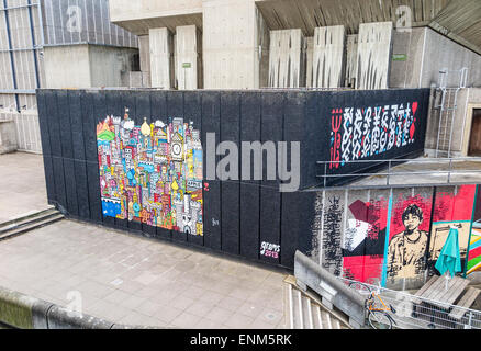 Colourful mural painting by grems on an outside wall on the South Bank Centre on the Embankment by Waterloo Bridge, Lambeth, London, UK Stock Photo