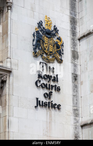 Name sign and coat of arms at the entrance of the Royal Courts of Justice (law courts), Strand, Westminster, London WC2 Stock Photo