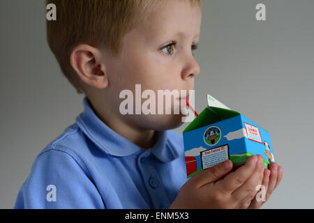 A little boy with his school milk. Picture: Scott Bairstow/Alamy Stock Photo