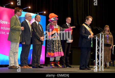 Brighton, UK. 8th May, 2015. Peter Kyle (right) of Labour on the stage at the Brighton Centre after winning the Hove seat alongside Dame Dixon and Conservative Graham Cox   Credit:  Simon Dack/Alamy Live News Stock Photo