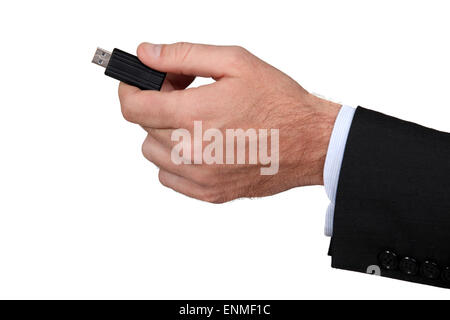 businessman holding a flash drive Stock Photo