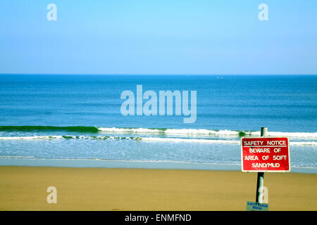 CAYTON BAY, NORTH YORKSHIRE, UK. APRIL 24, 2015.  A safety notice on the beach at Cayton Bay in Yorkshire, uk. Stock Photo