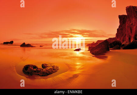 Portugal, Algarve: Scenic sunset at rocky beach in Sagres