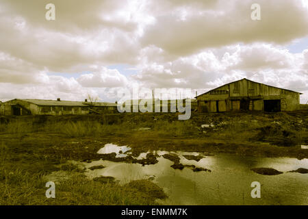 A lot of farms are abandoned in Russia and look similar to Stock Photo