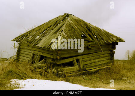 Rickety wooden house without one angle, but yet with the roof Stock Photo