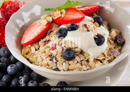 Healthy Breakfast -  berries, yogurt and  muesli. Selective focus Stock Photo