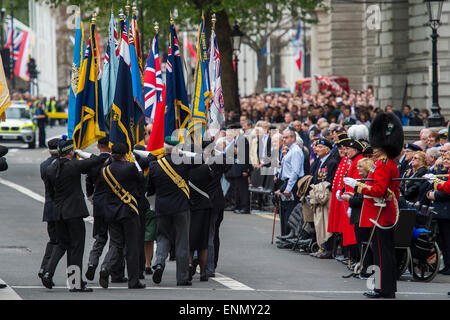 London, UK. 8th May, 2015. British Legion flag bearers march off and are saluteed by veterans after the memorial service in Whitehall. VE Day 70 commemorations - Three days of events in London and across the UK marking historic anniversary of end of the Second World War in Europe. Credit:  Guy Bell/Alamy Live News Stock Photo