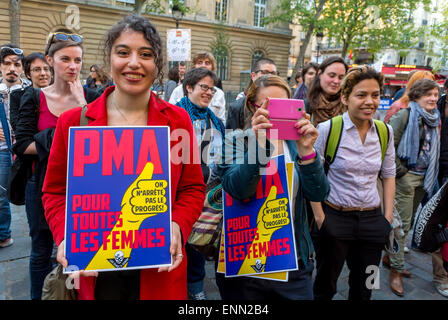 Paris, France., Street Demonstration, 2nd Anniversary of Gay Marriage Law, LGBT N.G.O.'s protest for access for M.A.P. Reproduction Rights, (PMA) (Medically Assited Pregnancy) Trans Women Holding French protest poster on Street, human rights activists, Rally against discrimination, social justice slogans, protest for justice, 2015 Stock Photo