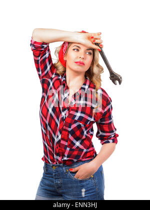 The blonde holds a wrench on a white background Stock Photo