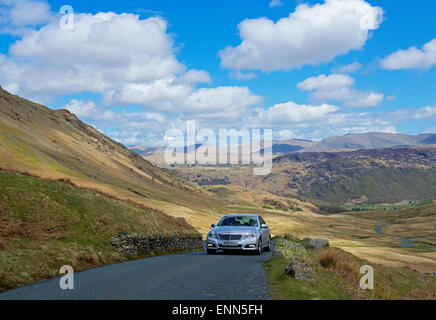 Car on Honister Pass (B5289), Lake District National Park, Cumbria, England UK Stock Photo