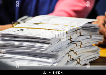 Voting slips are bundled up after being counted during a UK general election Stock Photo