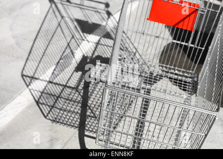 Color image of an abandoned shopping trolley in a parking lot. Stock Photo