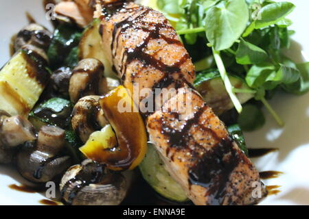 salmon fish with new potatoes, seasonal green salad and a lemon wedge, Balanced meal Grilled pan seared Atlantic scottish salmon stock, photo Stock Photo