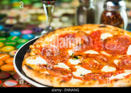 Napolitana Style Pizza on the table in Italian restaurant. Stock Photo