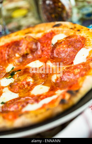 Napolitana Style Pizza on the table in Italian restaurant. Stock Photo