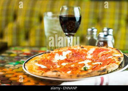 Napolitana Style Pizza on the table in Italian restaurant. Stock Photo