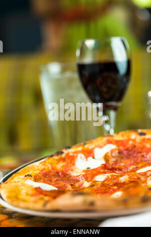 Napolitana Style Pizza on the table in Italian restaurant. Stock Photo