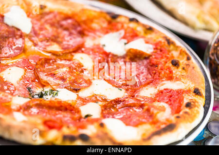 Napolitana Style Pizza on the table in Italian restaurant. Stock Photo