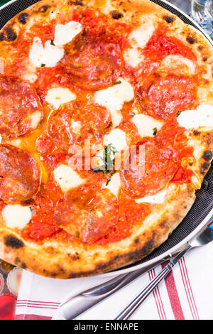 Napolitana Style Pizza on the table in Italian restaurant. Stock Photo