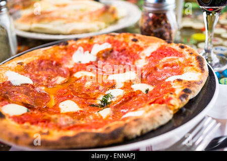 Napolitana Style Pizza on the table in Italian restaurant. Stock Photo