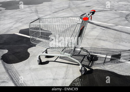 Color image of an abandoned shopping trolley in a parking lot. Stock Photo