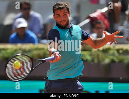 Madrid, Spain. 8th May, 2015. Grigor Dimitrov of Bulgaria returns the ball during the men's singles quarterfinal against Rafael Nadal of Spain at the Madrid Open tennis tournament in Madrid, Spain, May 8, 2015. Grigor Dimitrov lost 0-2. Credit:  Xie Haining/Xinhua/Alamy Live News Stock Photo