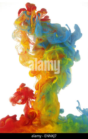 Clouds of bright colorful ink mixing in water Stock Photo