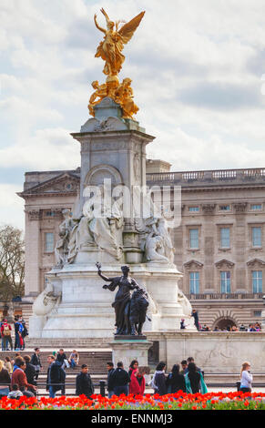 LONDON - APRIL 12: Queen Victoria memorial monument in front of the Buckingham palace on April 12, 2015 in London, UK. Stock Photo