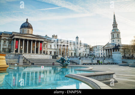 LONDON - APRIL 12: National Gallery building at Trafalgar square on April 12, 2015 in London, UK. Founded in 1824. Stock Photo