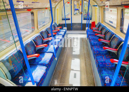 LONDON - APRIL 15: Interior of the underground train car on April 15, 2015 in London, UK. The system serves 270 stations. Stock Photo