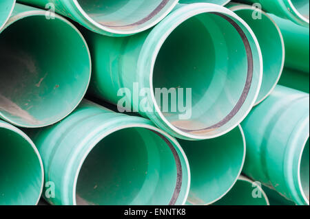 Green plastic pipes for drains water for building Stock Photo