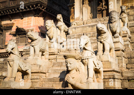 Statues lining steps of historic Hindu temple in Bhaktapur, Nepal Stock Photo