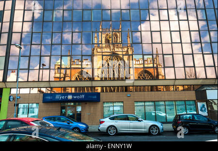 Holy Trinity Church reflected in office windows in Kingston upon Hull East Yorkshire UK Stock Photo