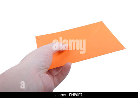 Hand with orange envelope on white background. Stock Photo