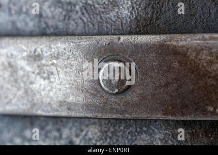 Metal rivet connecting metal plates Stock Photo