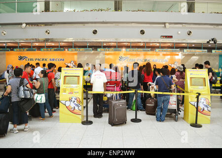 Cebu Pacific flights check in at Davao International Airport. Cebu Pacific is one of the most popular Filipino flying agency in the Philippines. Stock Photo