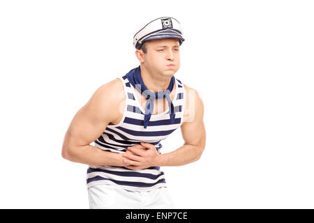 Young male sailor feeling stomach ache isolated on white background Stock Photo