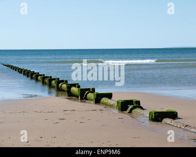 Sewage pipe on the beach in Harlech Gwynedd Wales UK Stock Photo