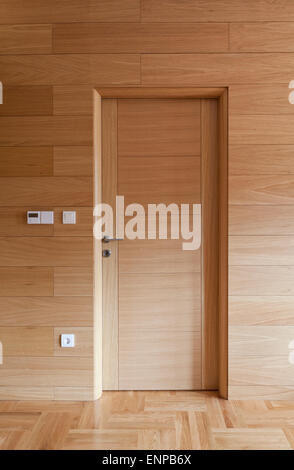 wooden door on wooden wall interior Stock Photo