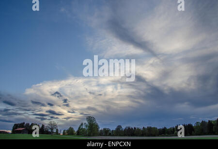 The last rays of sun touching an interesting cloud formation Stock Photo