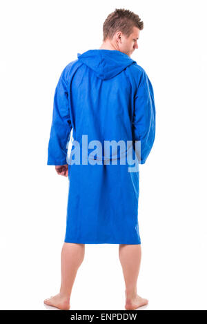 Handsome young man wearing blue bathrobe, isolated on white background Stock Photo