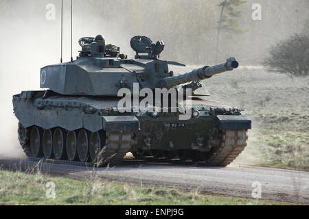 Challenger 2 Main Battle Tank creates a dust cloud as it travels at speed. Stock Photo