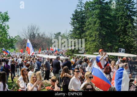 Toronto, Canada. 9th May 2015. Visitors of Ceremonial Parade for 70 years anniversary of Victory Day (1945-2015). Victory Day marks the capitulation of Nazi Germany to the Soviet Union in the part of the Second World War. By Soviet and then Russian tradition such parades take place on 9 May, as the Soviet government announced the victory early on that day after the signing ceremony in Berlin. Credit:  Igor Ilyutkin/Alamy Live News Stock Photo