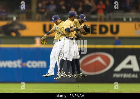 Milwaukee, WI, USA. 9th May, 2015. The Brewer outfielders celebrate after defeating the Cubs 12-4 in the Major League Baseball game between the Milwaukee Brewers and the Chicago Cubs at Miller Park in Milwaukee, WI. John Fisher/CSM/Alamy Live News Stock Photo