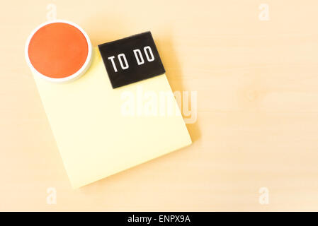 To Do List on Yellow Sticky Paper Note on Brown Background Stock Photo