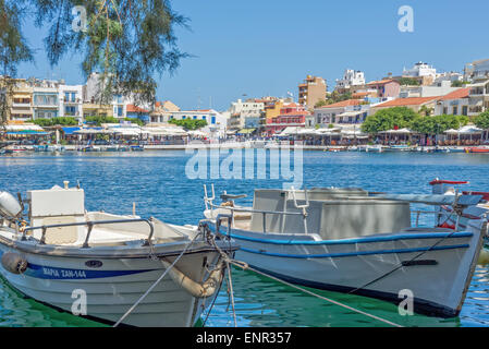 Two fishing boats moored in a lake in a tourist spot in Crete Stock Photo