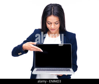 Happy businesswoman pointing on the blank laptop screen over white background Stock Photo