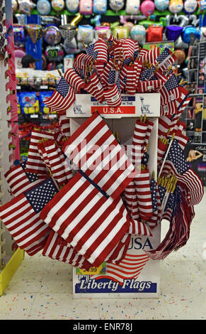 A display of American flags for sale for the 4th of July at the Party Store on West 14th Street in Greenwich Village, New York. Stock Photo
